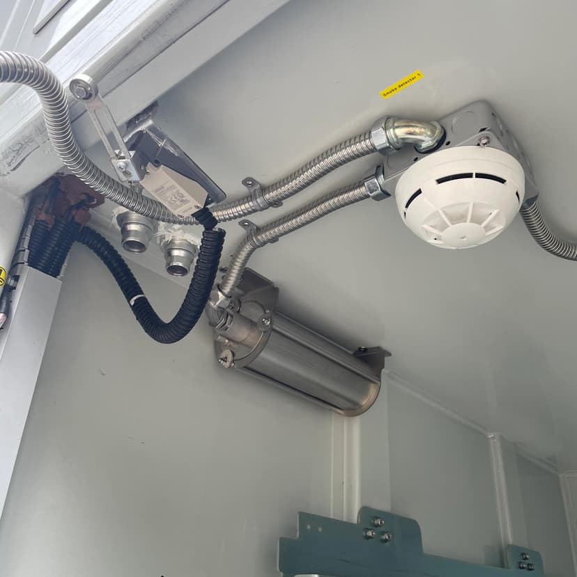 Aerosol extinguishing cylinder bank and detectors