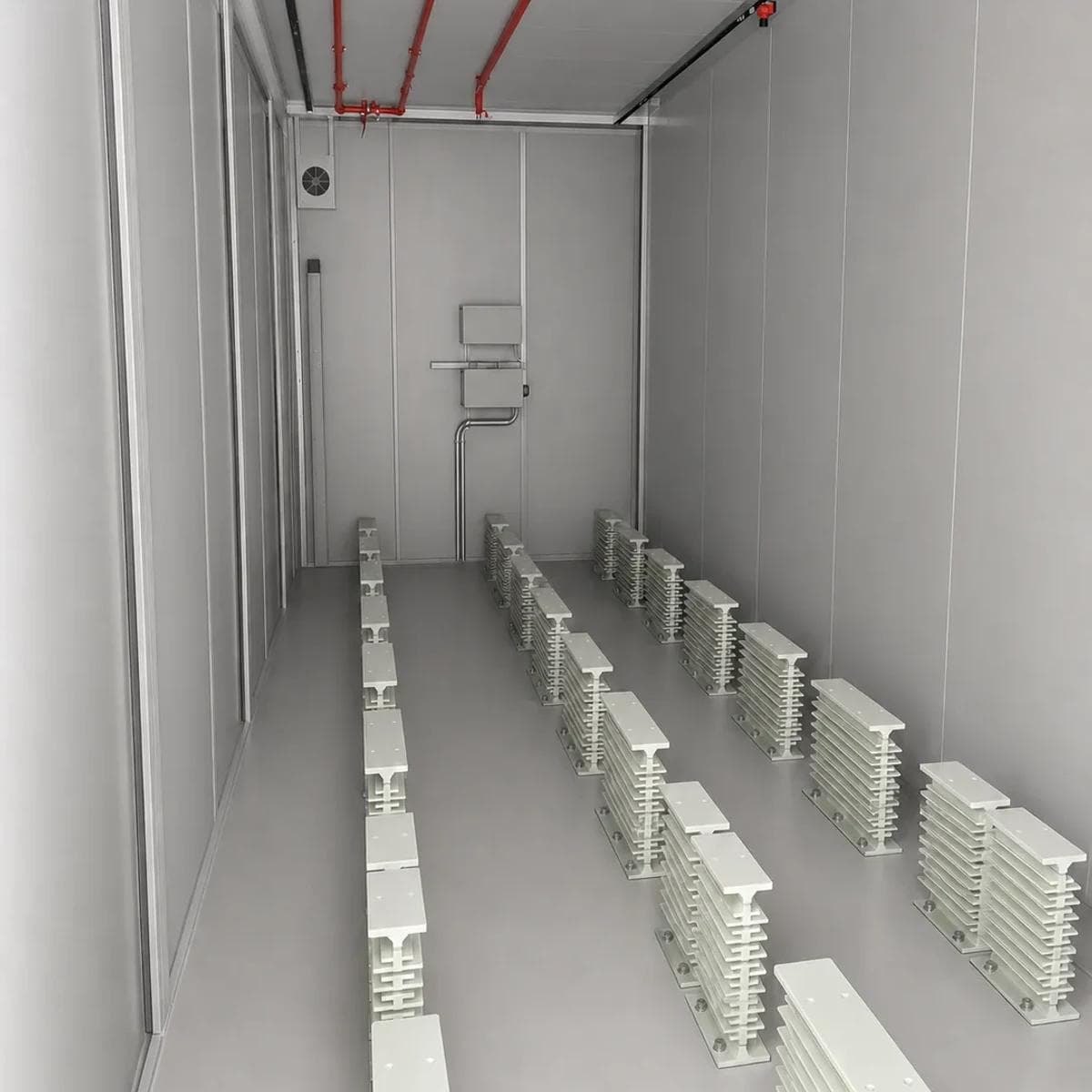Rows of equipment support bases and the maintenance aisle inside the cabin