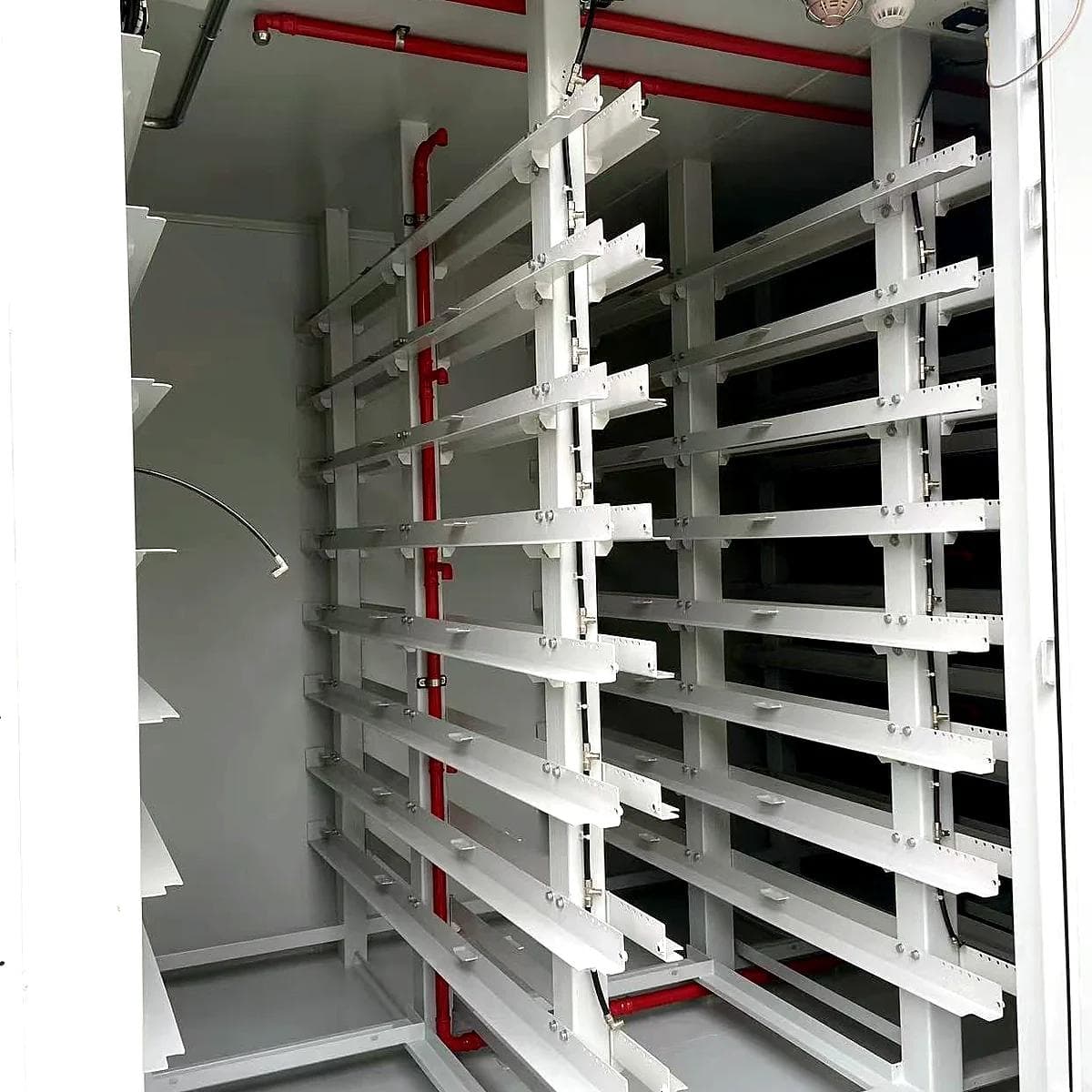 Multiple battery-rack rows inside the cabin
